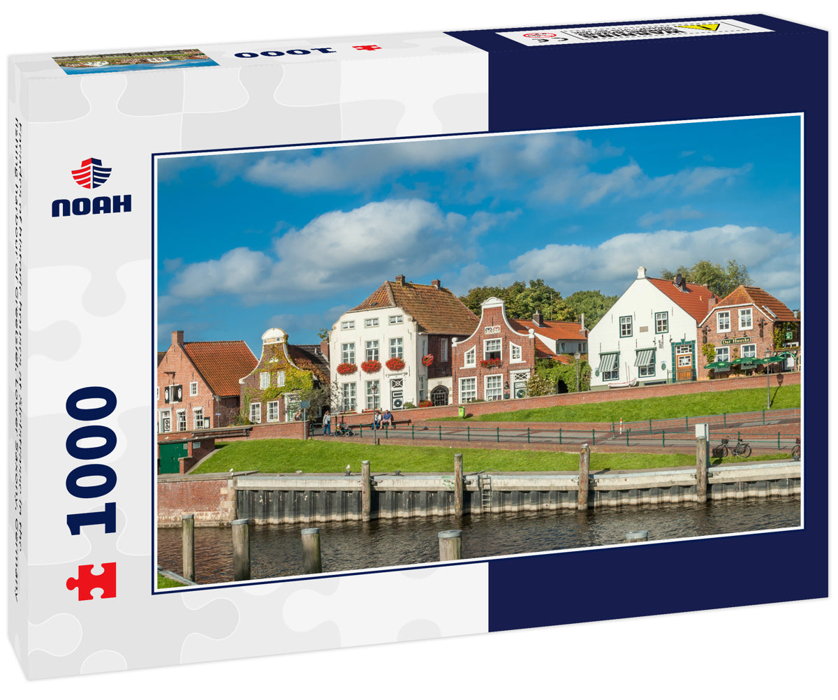 Facades of historic houses at Sielstrasse in the fishing harbour of Greetsiel, Lower Saxony, Germany