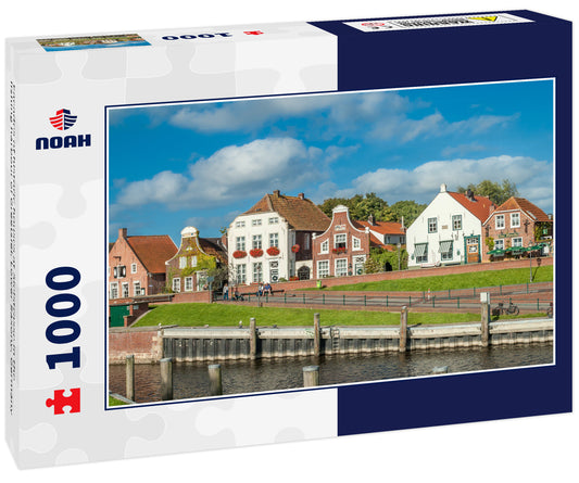 Facades of historic houses at Sielstrasse in the fishing harbour of Greetsiel, Lower Saxony, Germany