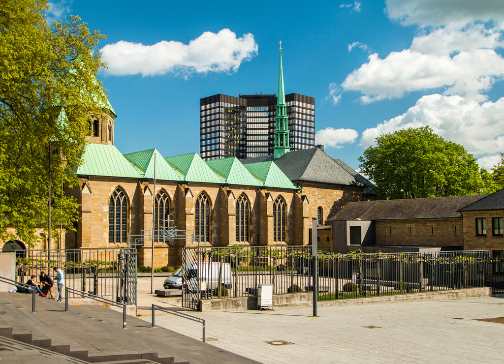 Cathedral in Essen, Germany, and modern business tower, city skyline