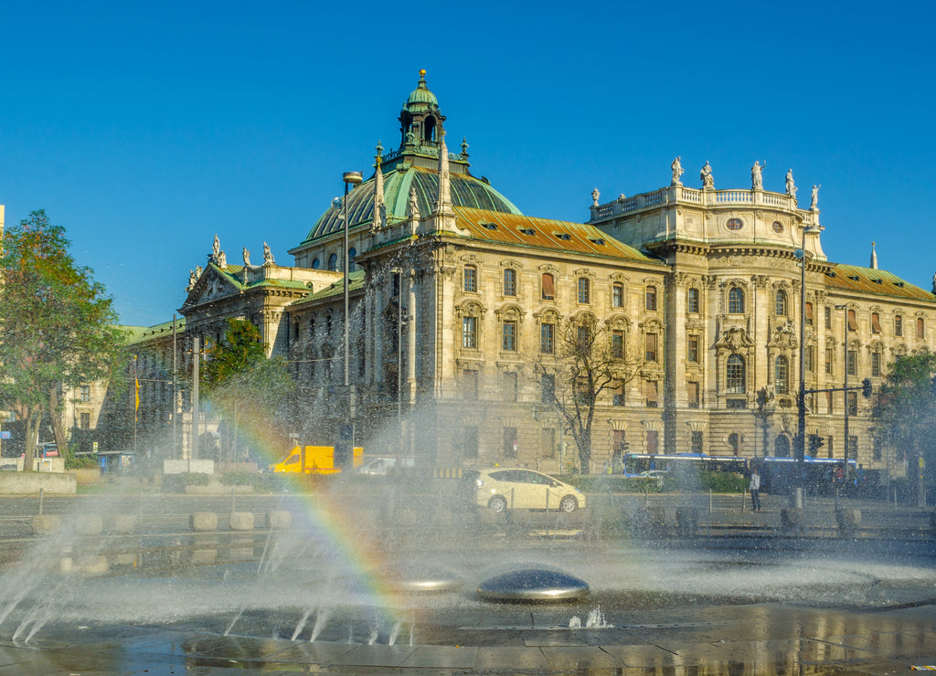 View of langericht court in german city munich hidden behind magnificent fountain