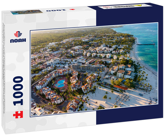 Aerial drone view of beach resort hotels with pools, umbrellas and blue water of Atlantic Ocean, Bavaro, Punta Cana, Dominican Republic