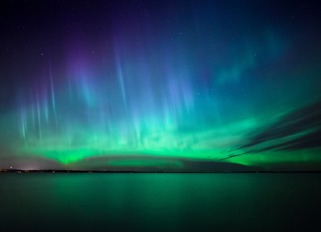 Northern lights over lake in Finland