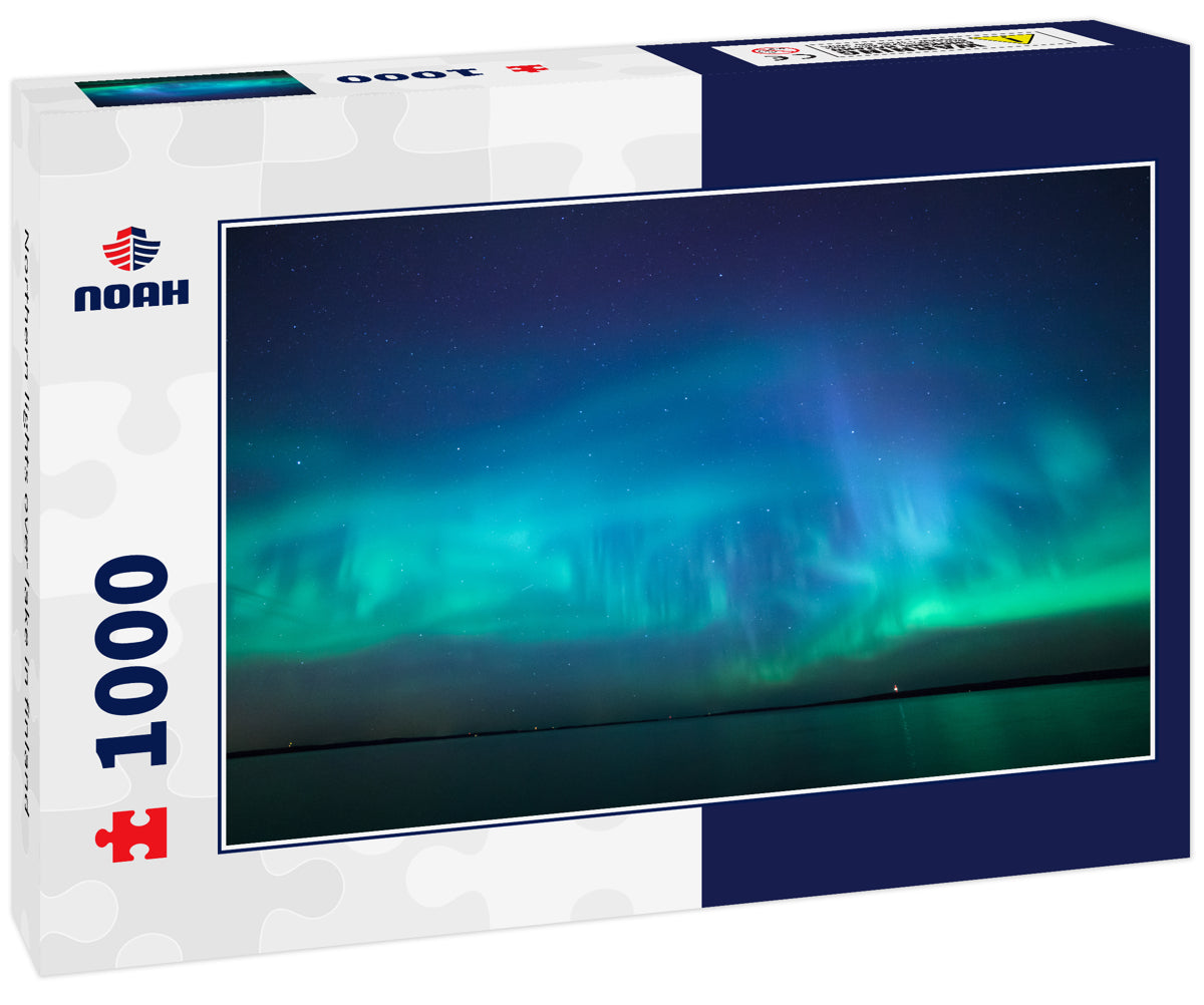 Northern lights over lake in finland