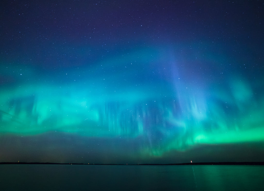 Northern lights over lake in finland