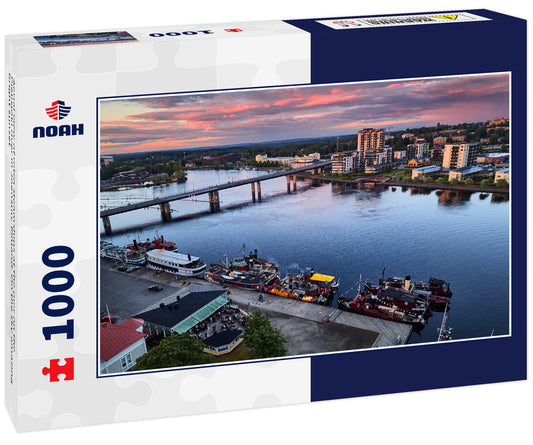 Aerial view of retro steamships at the pier on the Pielisjoki river in Joensuu, Finland. On the sky amazing bright sunset