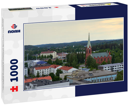 Panorama of the city of Mikkeli in Finland before the rain in summer: roofs of houses horizon forest lutheran church