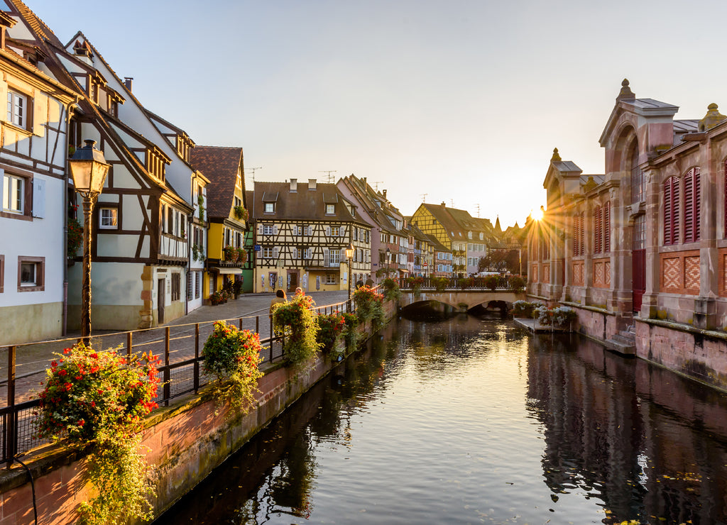 Beautiful view of the historic town of Colmar, also known as Little Venice, boat ride along traditional colorful houses on idyllic river Lauch in summer, Colmar, Alsace