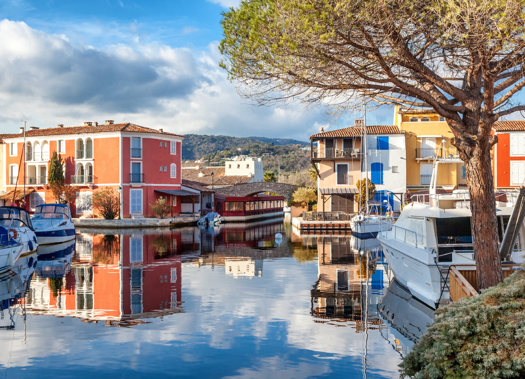 Colorful city on the water, Port of Grimaud, Côte d'Azur, France, Provence, houses and boats. Beautiful city landscape