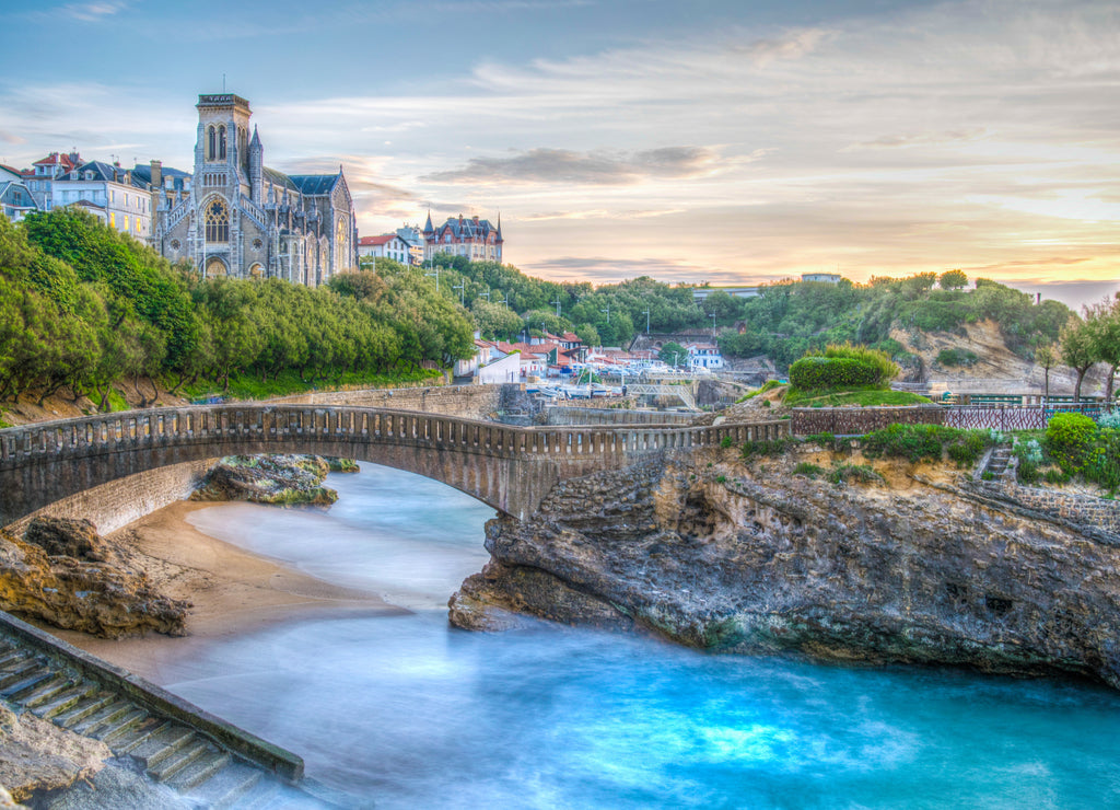 Sunset view of church Sainte-Eugenie and Rocher Du Basta island in Biarritz, France