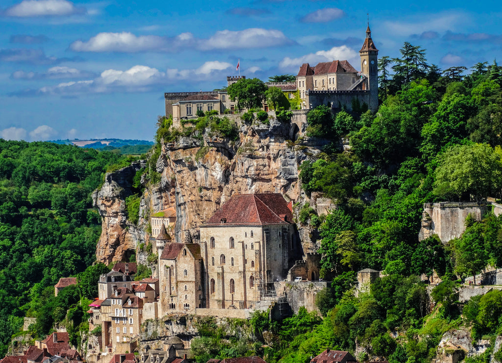 Rocamadour medieval sanctuary cityscape with blue sky and some clouds, Lot, France