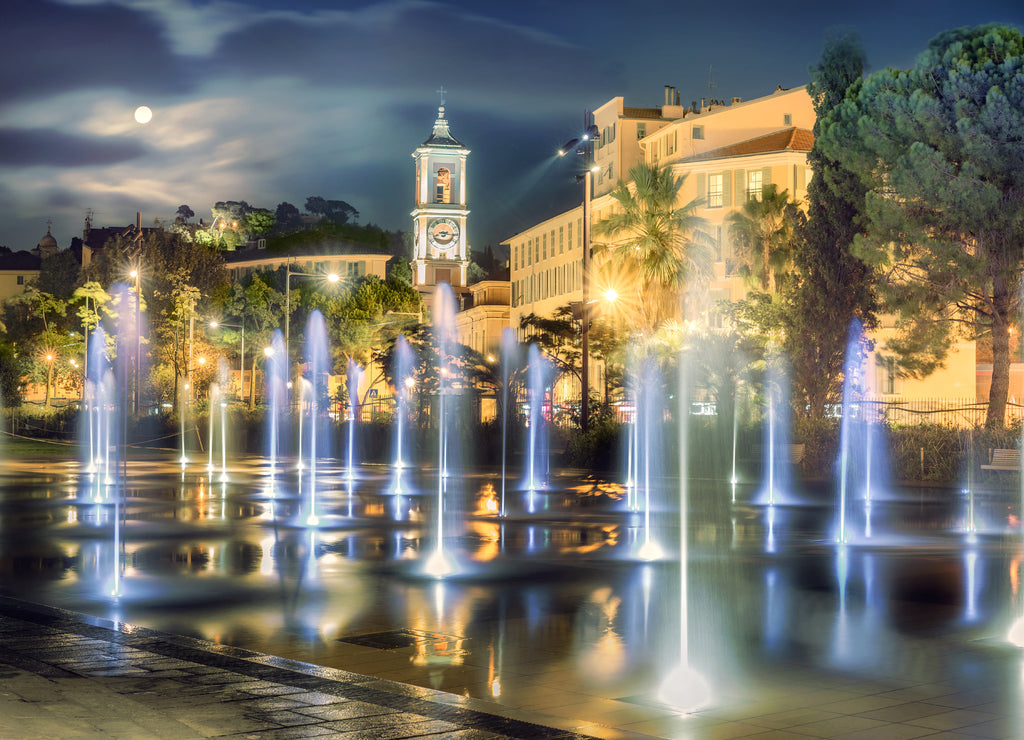 Beautiful fountain on Place Massena in Nice at night time. France