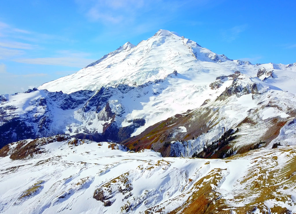 Aerial Overhead View Of Snowy Rocky Peak On Mount Baker, Washington, USA