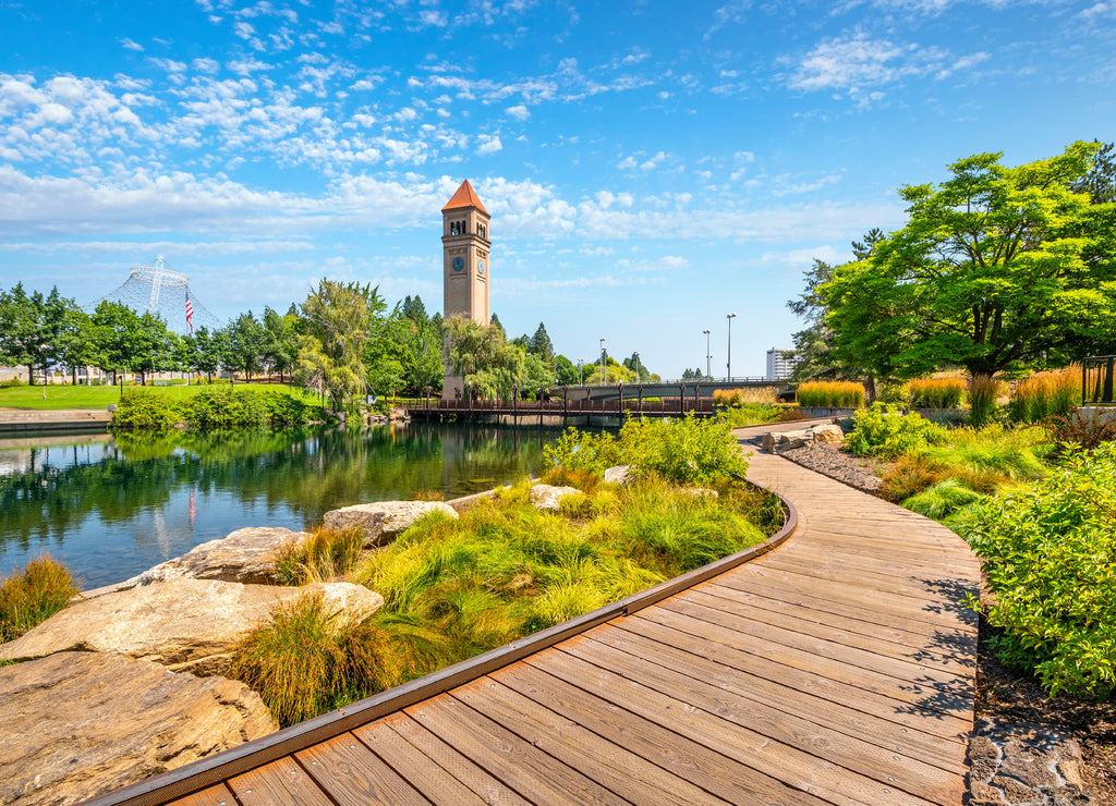 Summer day along the Spokane River in Riverfront Park with the Clock Tower, Pavilion and walking path in view, Washington