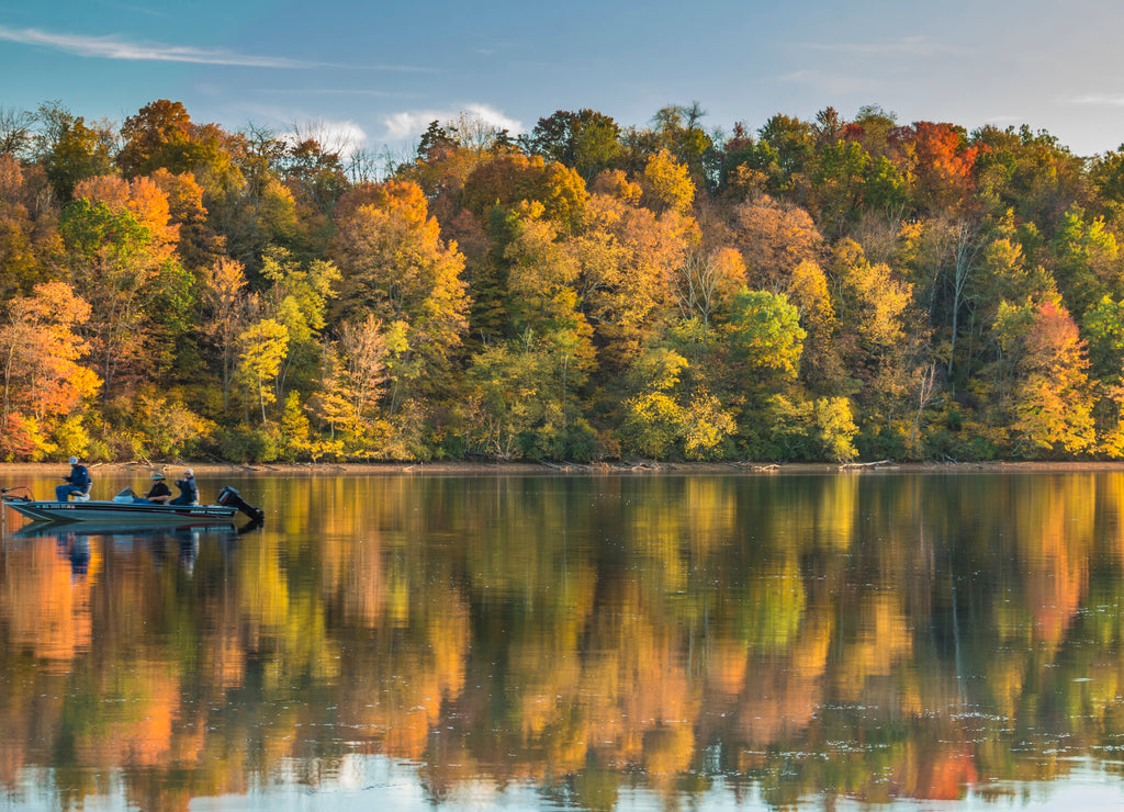 reflection of vibrant colorful peak autumn foliage of trees in the serene Lake Habeeb in Rocky Gap State Park in Western Maryland Allegany county