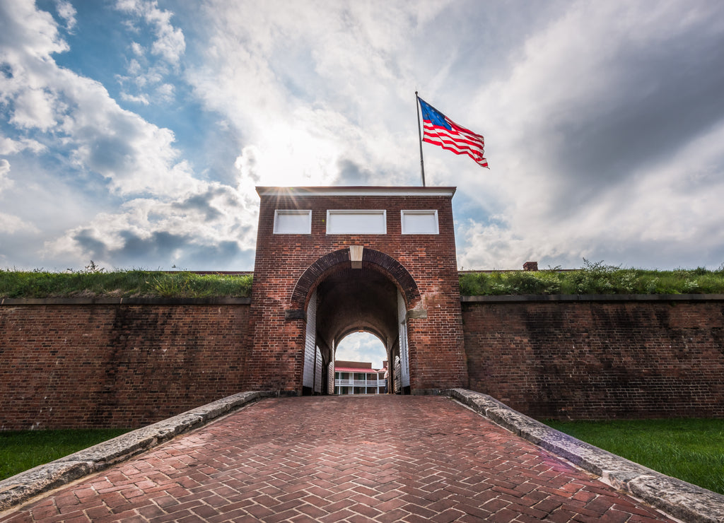 Historic American flying over the entrance to Fort McHenry National Monument, Baltimore, Maryland