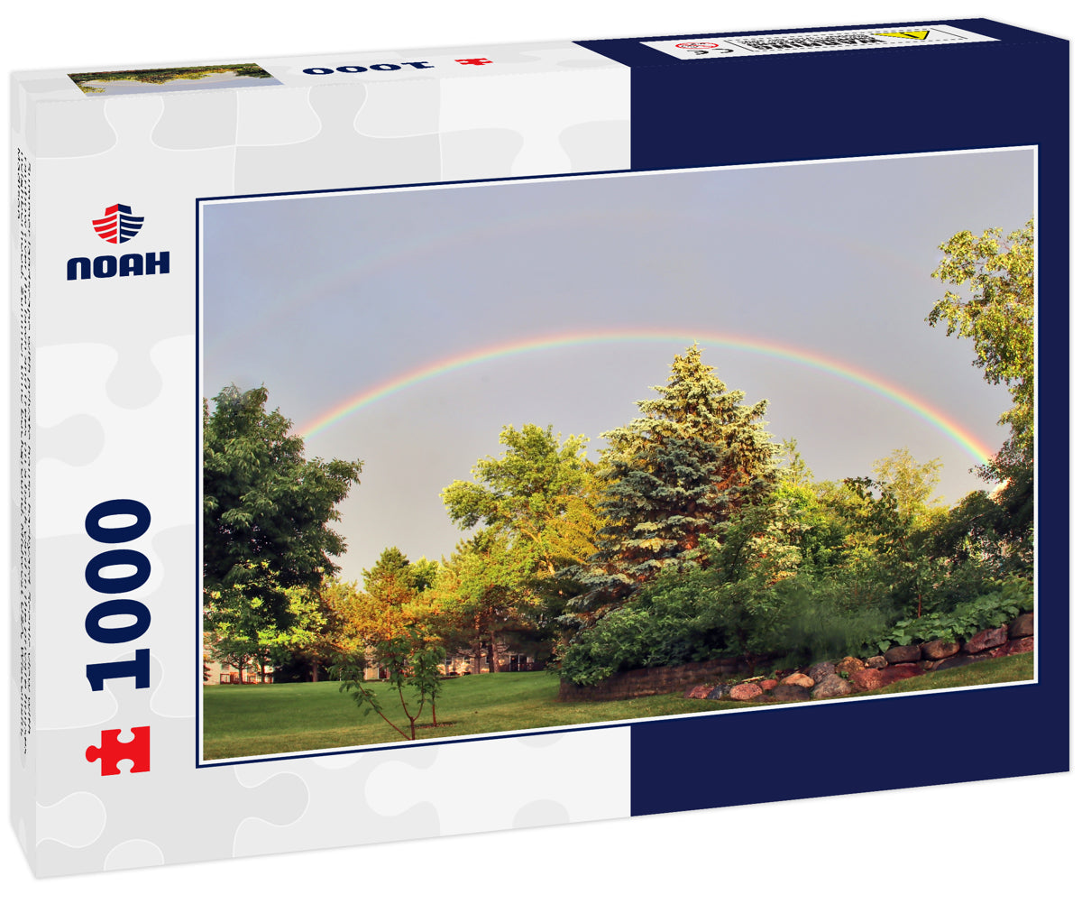 Summer landscape with private house backyard.Scenic view with rainbow over the lawn and trees on a back yard in the private houses neighborhood. Summer time background. Midwest USA, Wisconsin, Madison