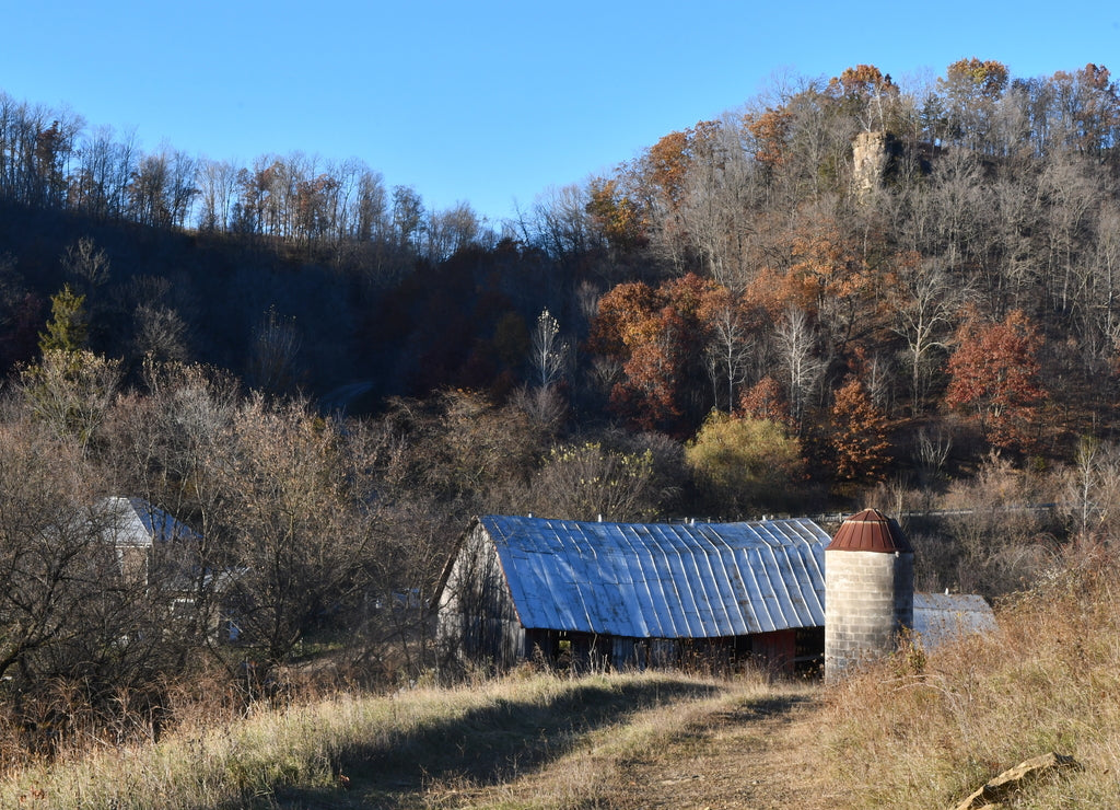 A homestead farm in the Driftless Area of Southwest Wisconsin, shown in the fall with oak trees and an old tobacco barn