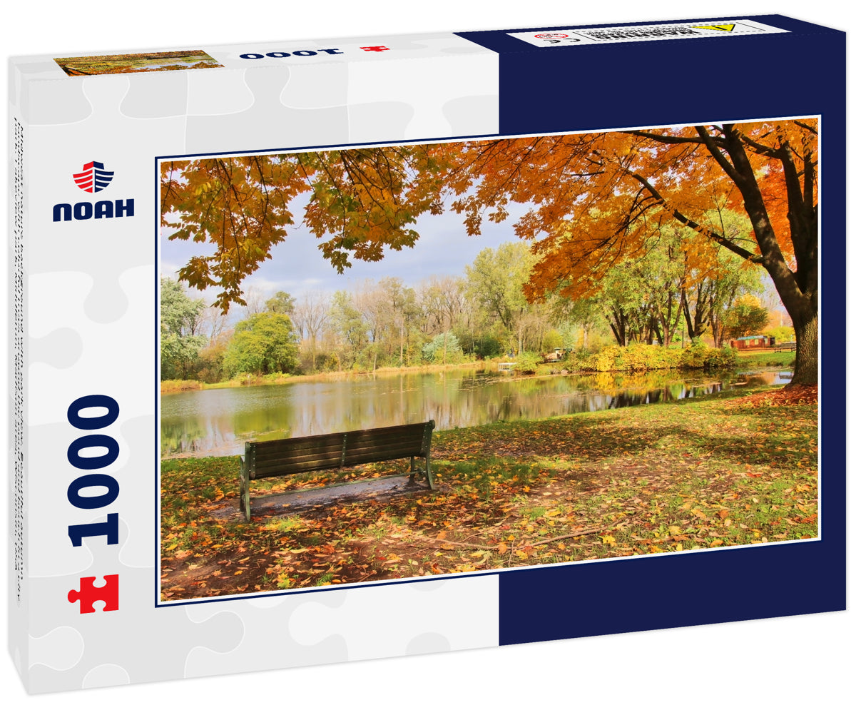 Midwest nature background with park view. Beautiful autumn landscape with colorful trees around the pond and bench in a city park. Lakeview park, Middleton, Madison area, Wisconsin, USA