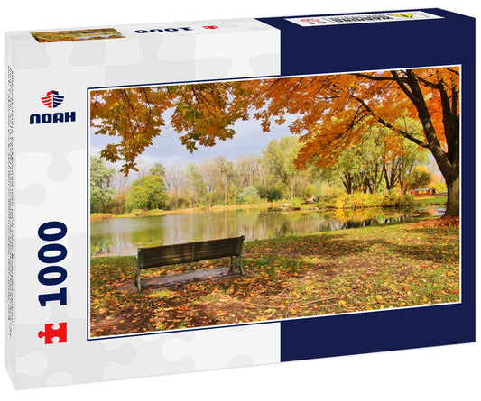 Midwest nature background with park view. Beautiful autumn landscape with colorful trees around the pond and bench in a city park. Lakeview park, Middleton, Madison area, Wisconsin, USA