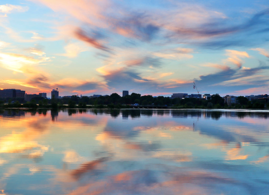 Beautiful colored after sunset sky reflects in water. Summer landscape with sunset over Madison, Wisconsin, USA