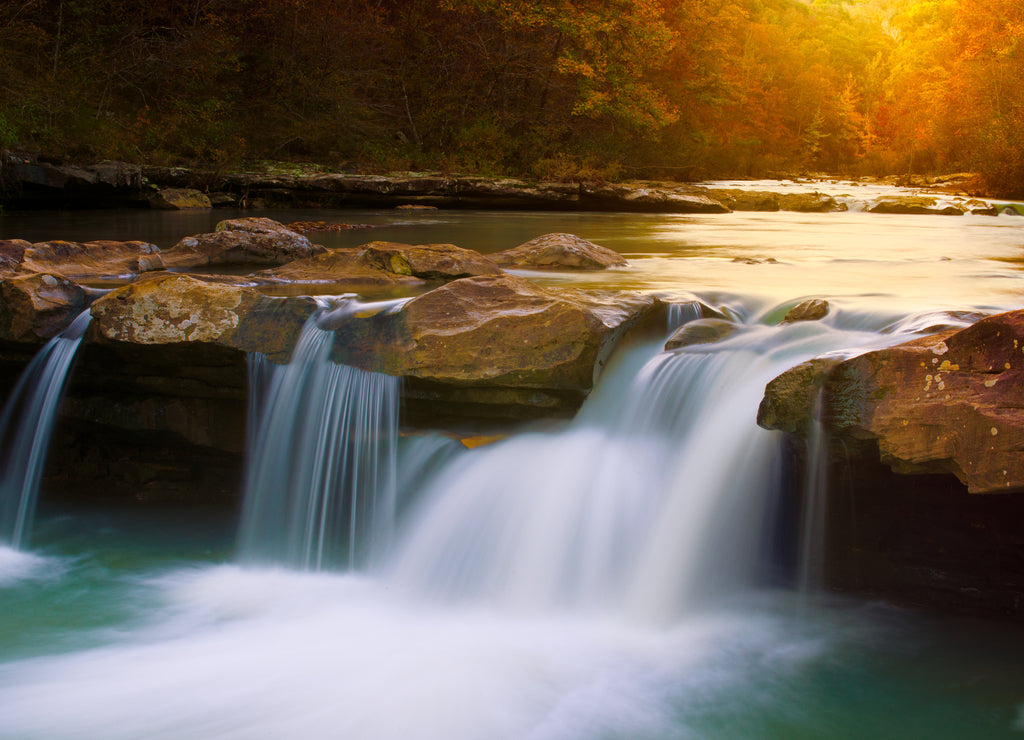 Cascading Arkansas Ozark mountain scene of King River waterfall cascade during a fall sunset