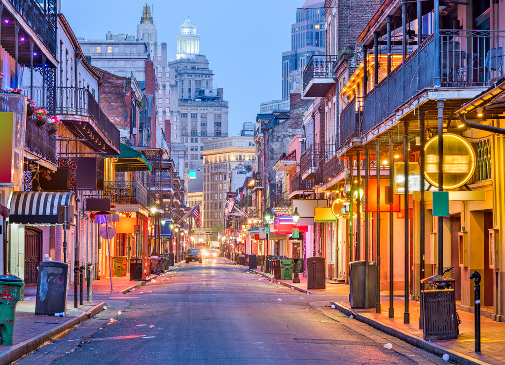 Bourbon St, New Orleans, Louisiana, USA cityscape of bars and restaurants at twilight