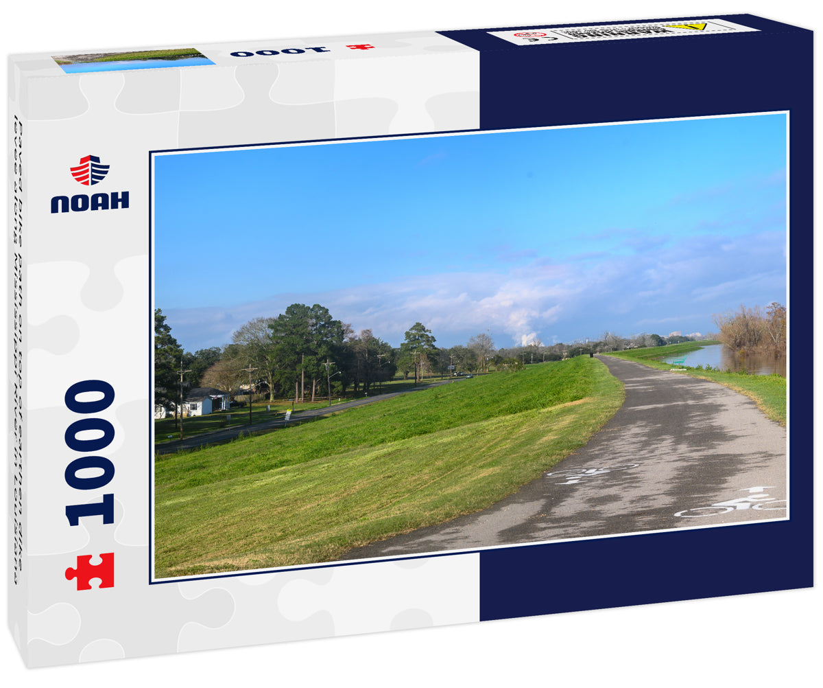 Paved bike path on top of earthen dike levee along Mississippi River in Louisiana