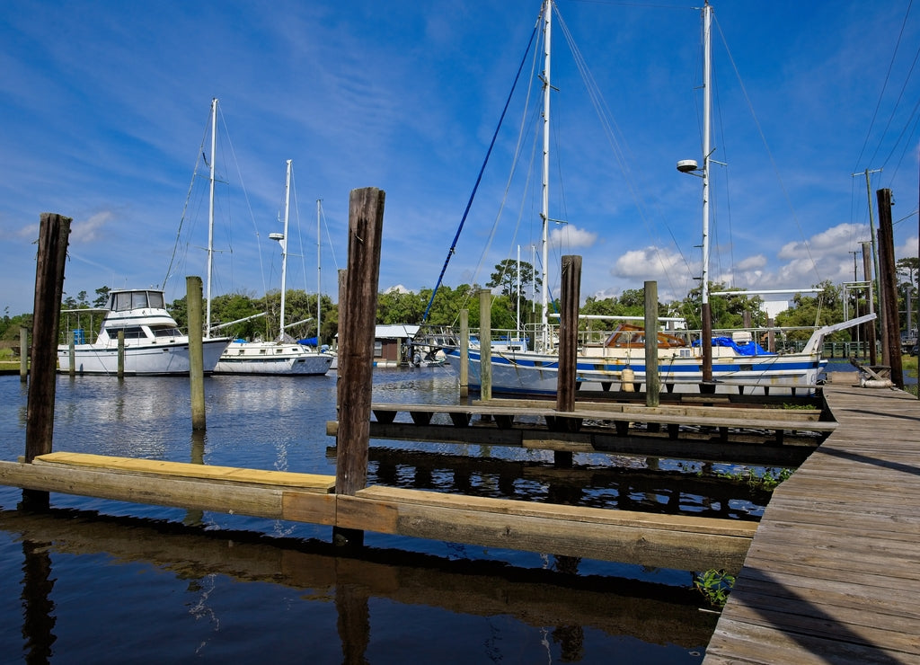 Boats moored in a marina in Bayou Libery in Slidell, Louisiana on a sunny spring day