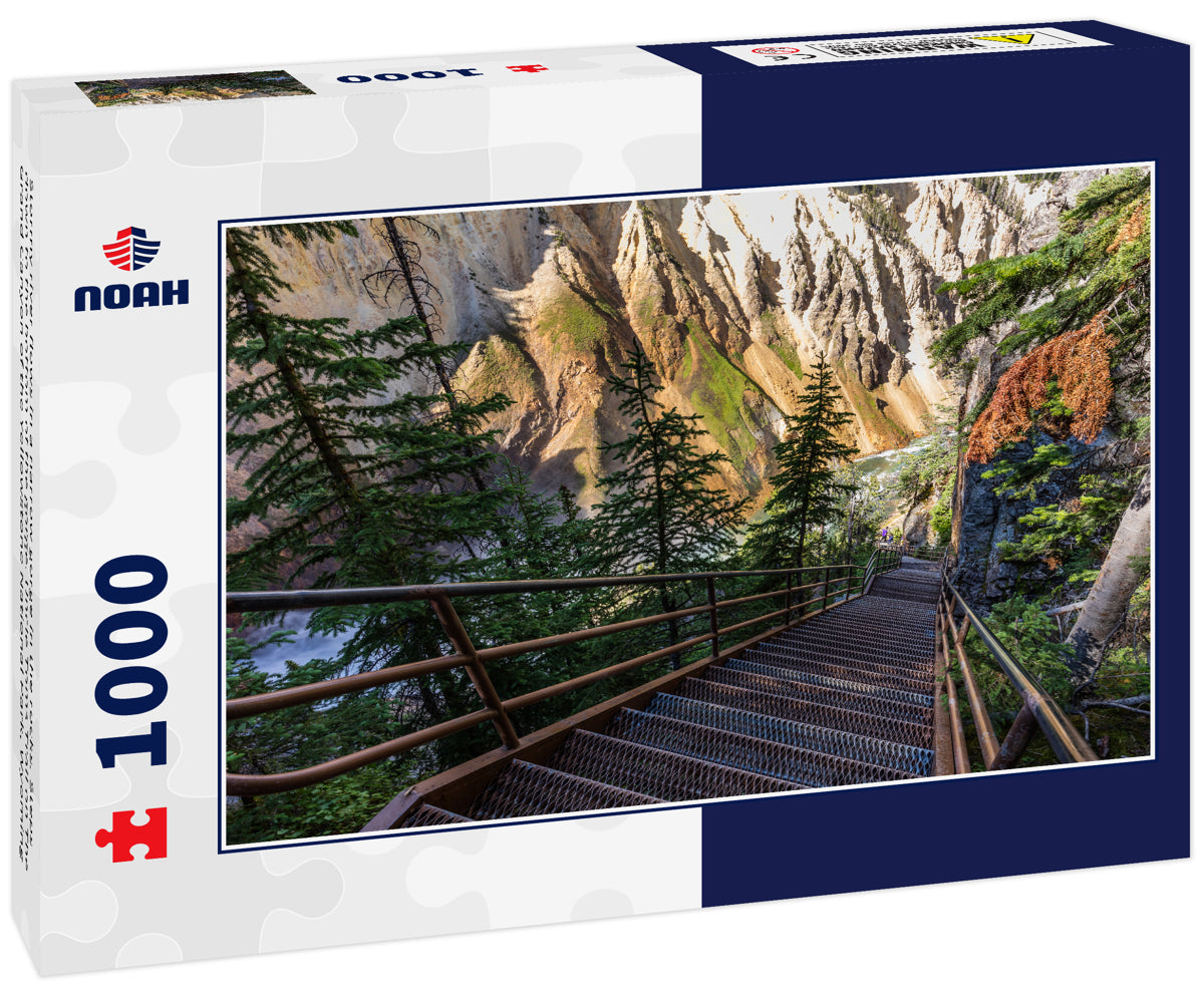 Stormy river flows in a narrow gorge in the rocks. Steps down to the bottom of the gorge. Uncle Toms Trail on The Grand Canyon of the Yellowstone National Park, Wyoming