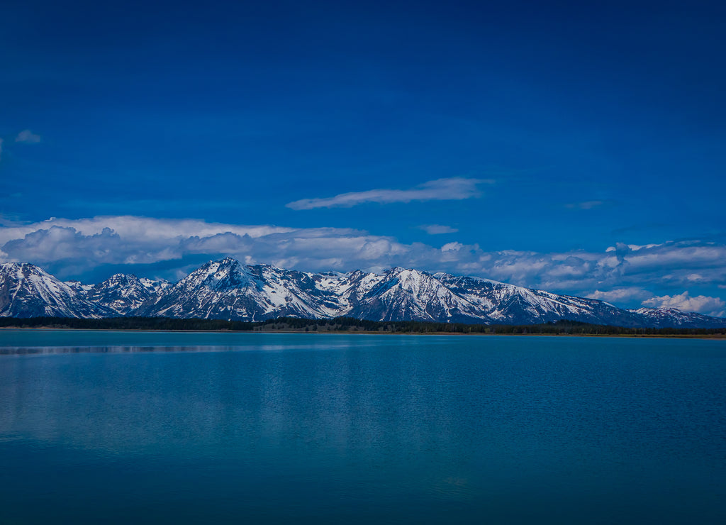 Beautiful landscape of Grand Teton National Park, Wyoming, reflection of mountains on Jackson Lake near Yellowstone