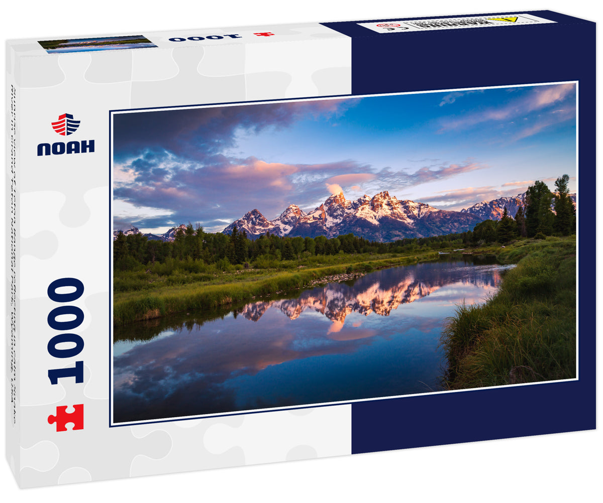 Sunrise view of Teton Range reflecting in calm Snake River in Grand Teton National Park, Wyoming, USA