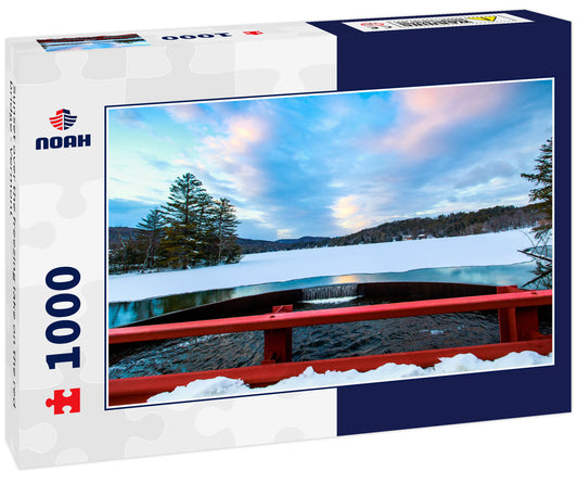 Sunset over the freezing lake on the red bridge - Vermont