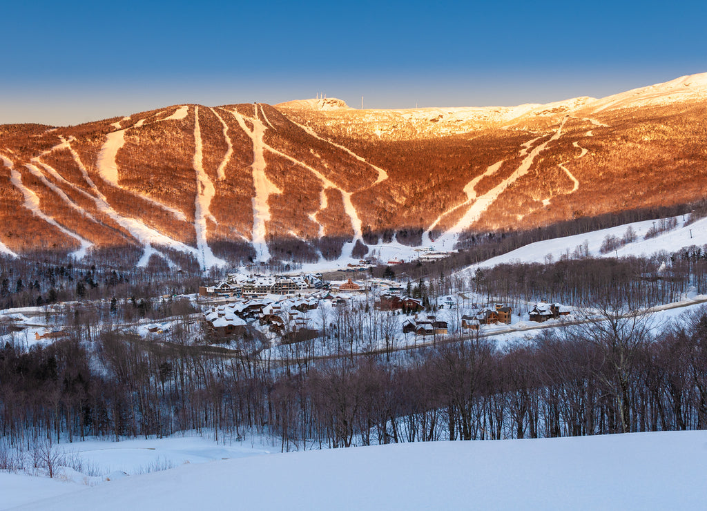 Looking down at the ski lodge and hotel with Mt. Mansfield looming behind, Stowe, Vermont, USA