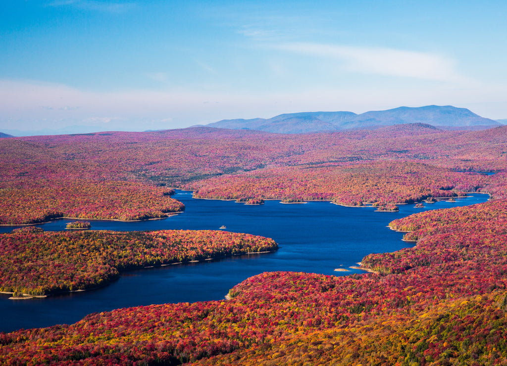 View from the Summit of Mt Snow, Vermont, near the town of Dover. Somerset reservoir and a huge hardwood forest in colorful fall foilage can be seenon the surrounding lands and waterways