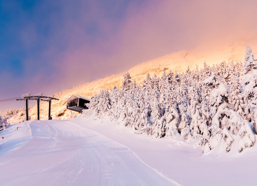 Sunrise on snow covered trees on gondola lift at Mt. Mansfield, Stowe, Vermont