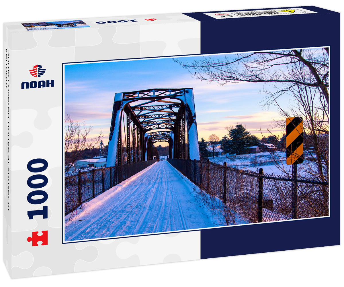 Snow covered bridge at sunset in Vermont