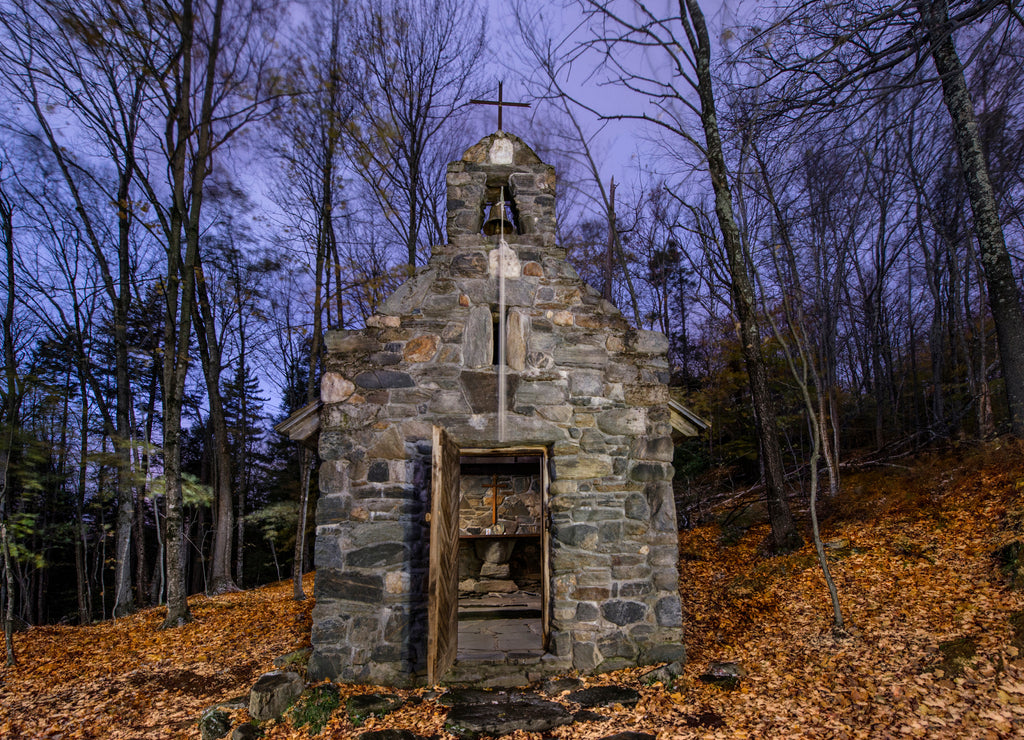 Tiny church in woods during Fall near Stowe Vermont