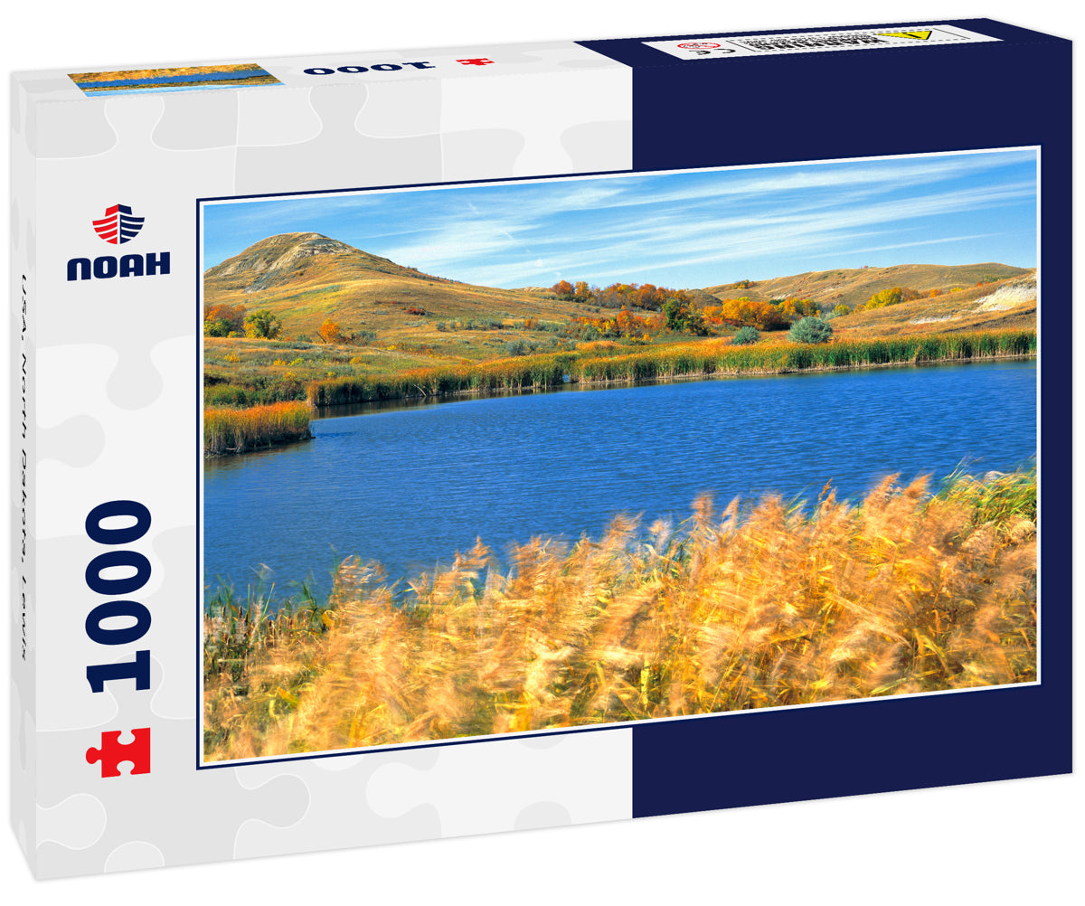 USA, North Dakota, Lewis & Clark SP. Autumn light slants over this deep blue pond in Lewis & Clark State Park, North Dakota