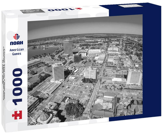 Noah Jigsaw Puzzle Lioness lying on a large tree. Close-up. Uganda. East Africa in black white 1000 pieces