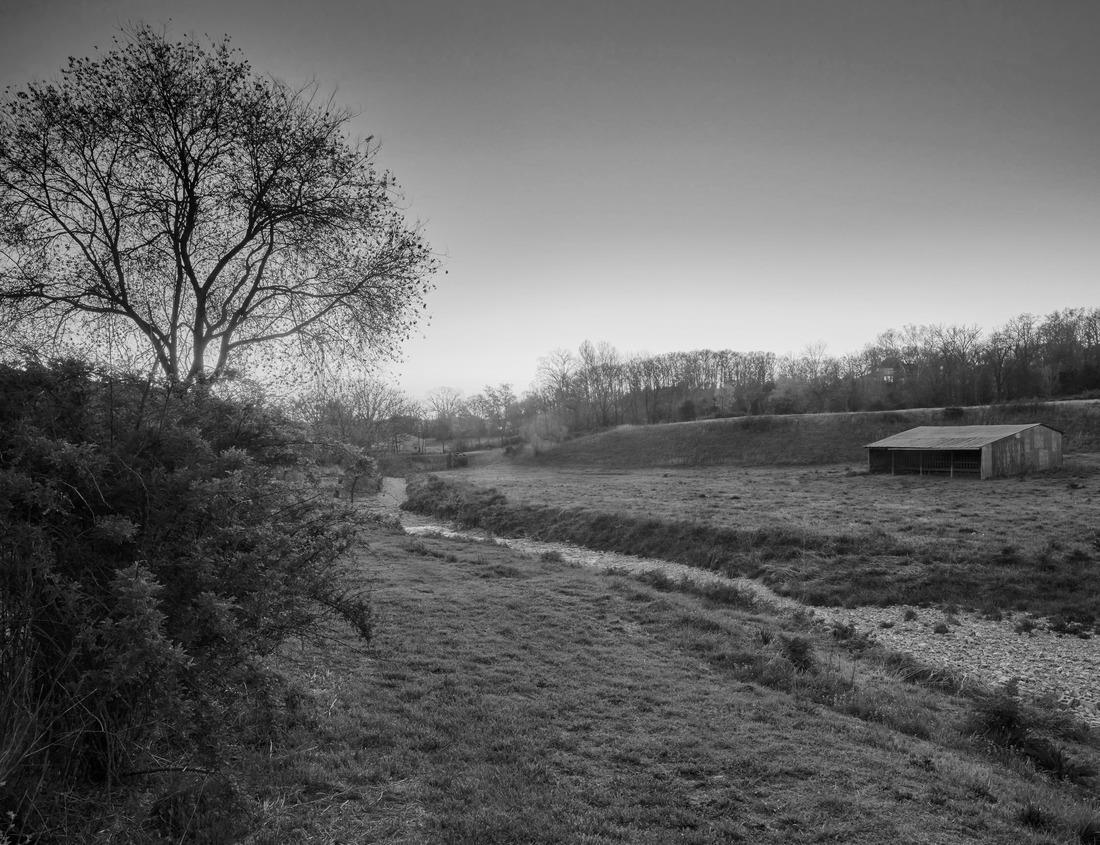 Sunset on a farm with an old barn near Bentonville, Arkansas, USA. 1000pc PuzzleBlack and White