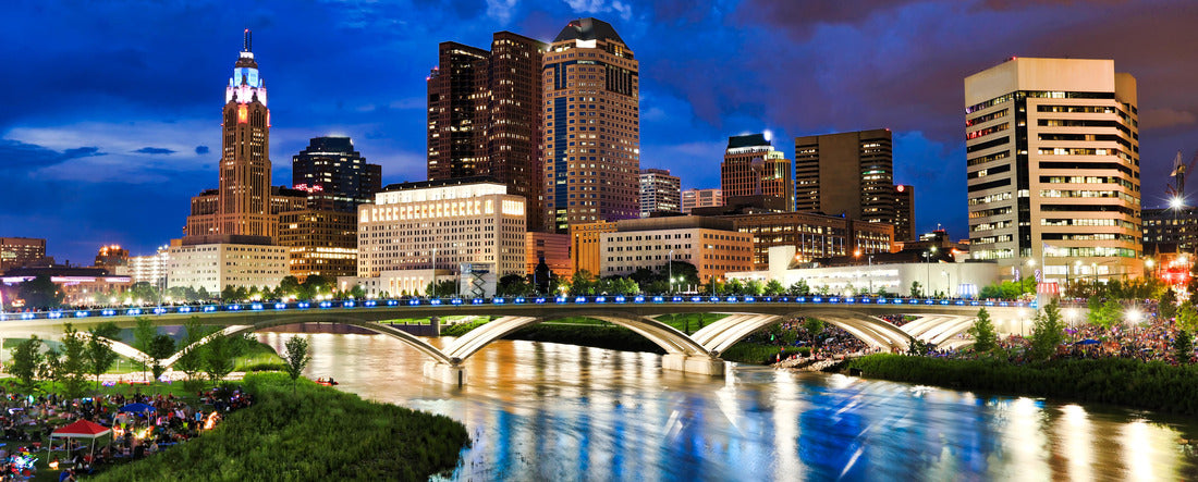People gather along the Scioto River in Columbus, Ohio, in anticipation of the annual red, white and boom fireworks display 2000pc Panoramic Puzzle