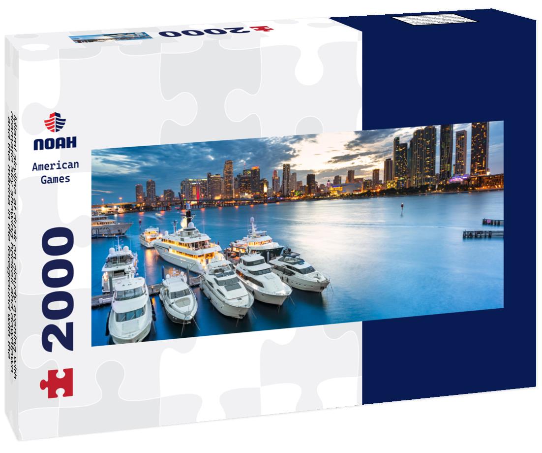 Miami skyline at dusk on cloudy evening with dramatic sky showing brickell and downtown and the marina in the foreground with the large impressive yachts and boats 2000pc Panoramic Puzzle