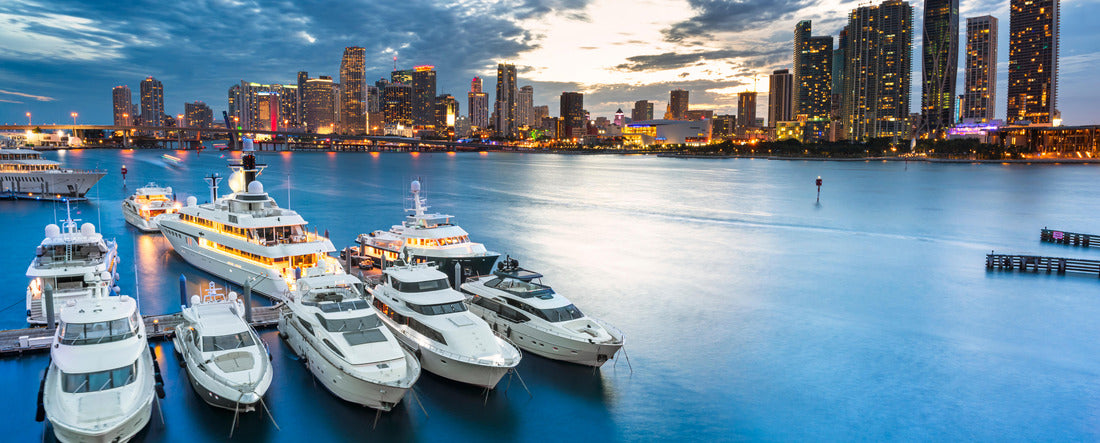 Miami skyline at dusk on cloudy evening with dramatic sky showing brickell and downtown and the marina in the foreground with the large impressive yachts and boats 2000pc Panoramic Puzzle