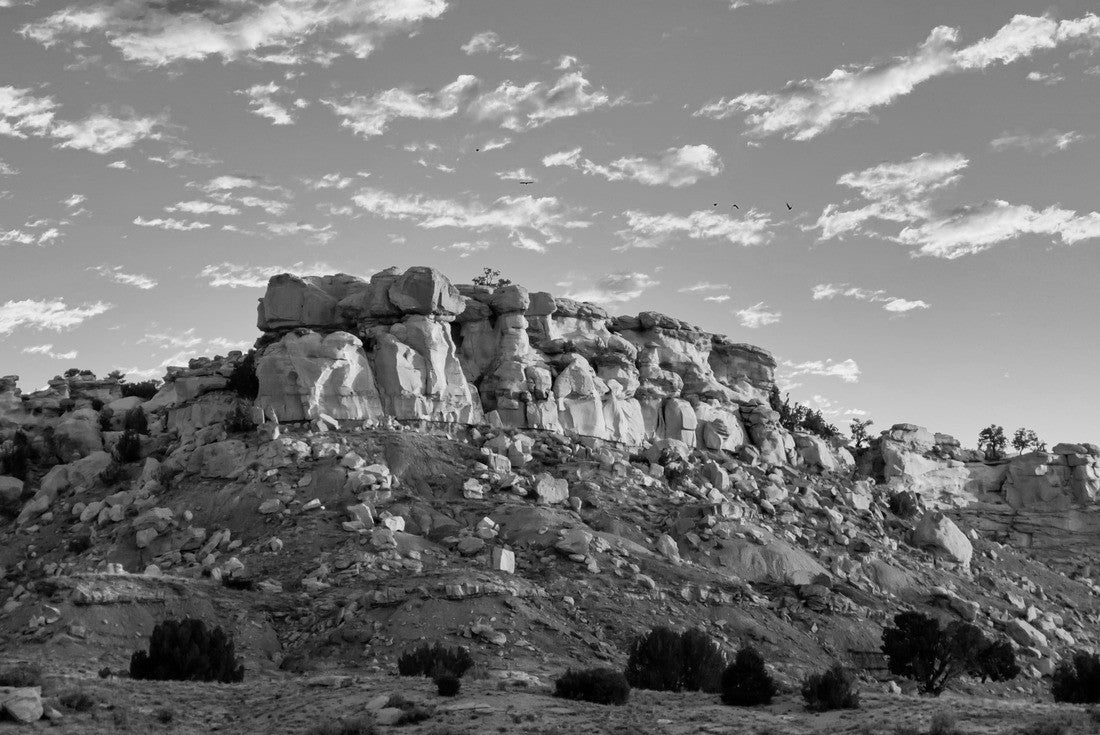 Noah Jigsaw Puzzle Sunrise on a Rocky Mesa in the New Mexico landscape with small puffy clouds in the blue sky in black white 2000 pieces
