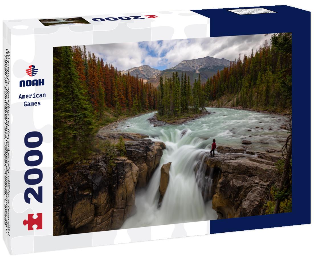 Noah Jigsaw Puzzle Woman is standing on the edge of a cliff by a beautiful Waterfall in the Canadian Rockies during summer day. Taken in Sunwapta Falls, Jasper, Alberta, Canada 2000 pieces