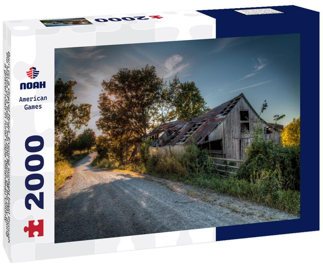 Noah Jigsaw Puzzle Barn on a Gravel Road. Evening sunlight blast through the leaves of a tree in the late hours of the day along a gravel road in rural Cape Girardeau County 2000 pieces