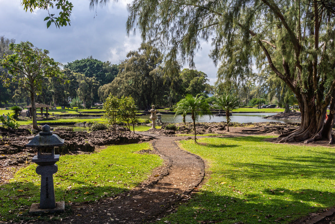 Hilo, Hawaii, USA: Path winding through green lawn among trees with Japanese lanterns on side in Liliuokalani Gardens. Sunshine but cloudscape 2000pc Puzzle