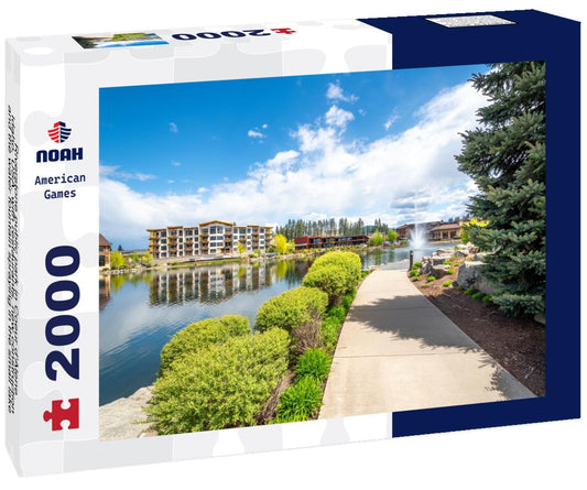 Noah Jigsaw Puzzle Riverstone public park in Coeur d'Alene, Idaho, USA, with restaurants, new construction and the water fountain spraying in the small lake 2000 pieces