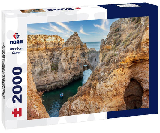 Noah Jigsaw Puzzle Blue boat on a rocky cavern at Ponta da Piedade, Lagos, one of the most beautiful areas of the beaches in Algarve - Portugal 2000 pieces