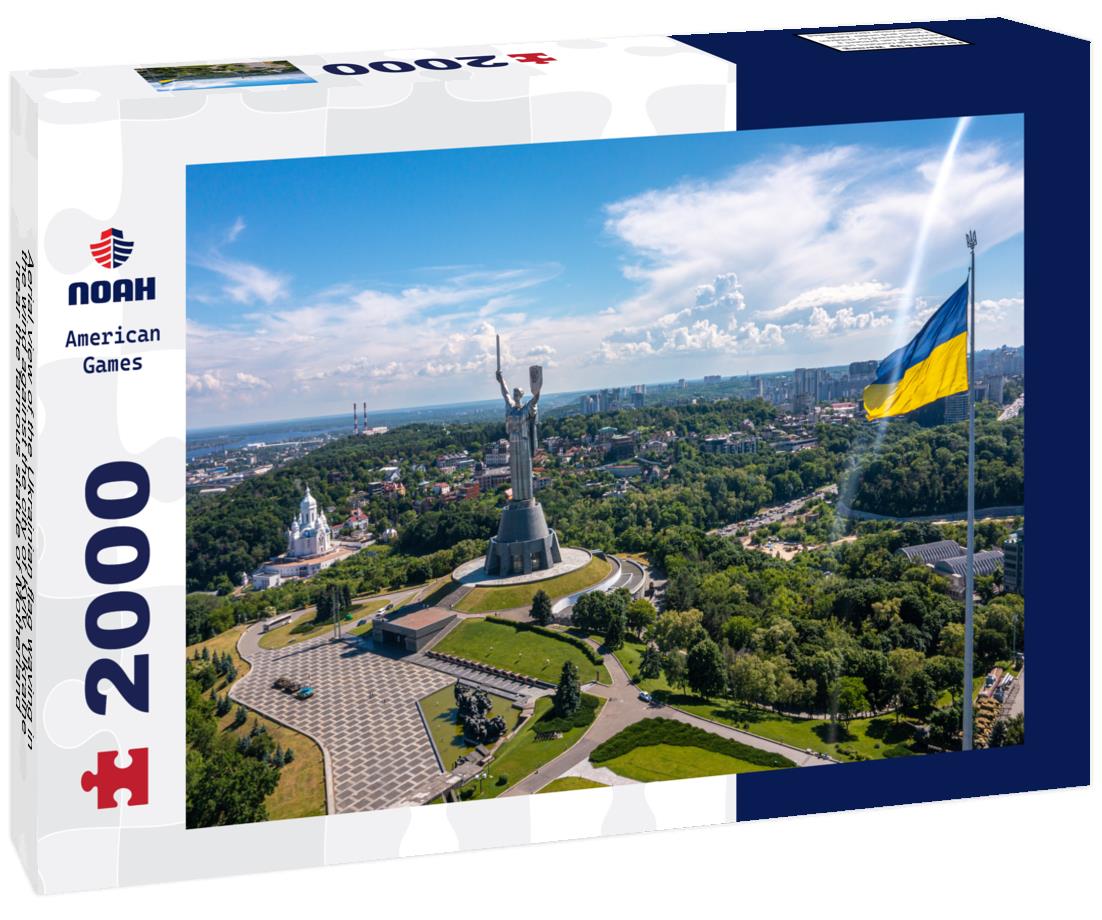 Noah Jigsaw Puzzle Aerial view of the Ukrainian flag waving in the wind against the city of Kyiv, Ukraine near the famous statue of Motherland 2000 pieces